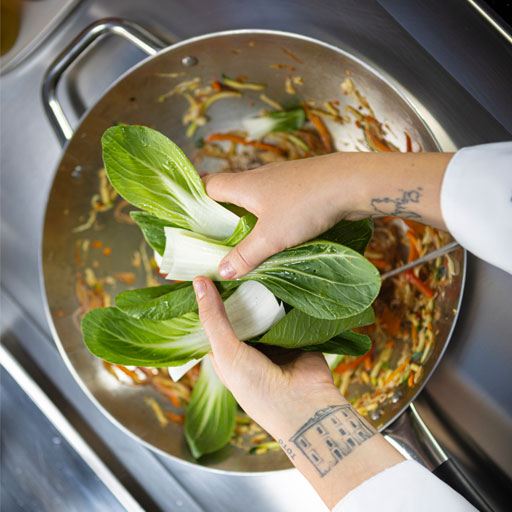 Chef cooking on a 700XP induction wok