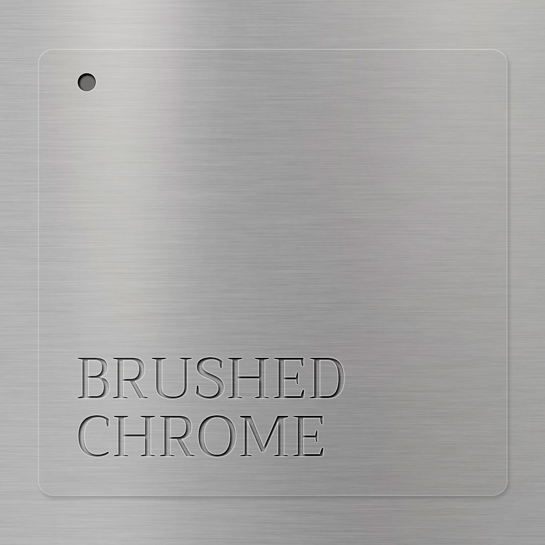Close-up of brushed chrome griddle plate showing lightly textured finish for durability and heavy use
