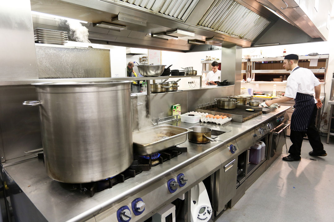 Busy commercial kitchen cooking with Electrolux Professional