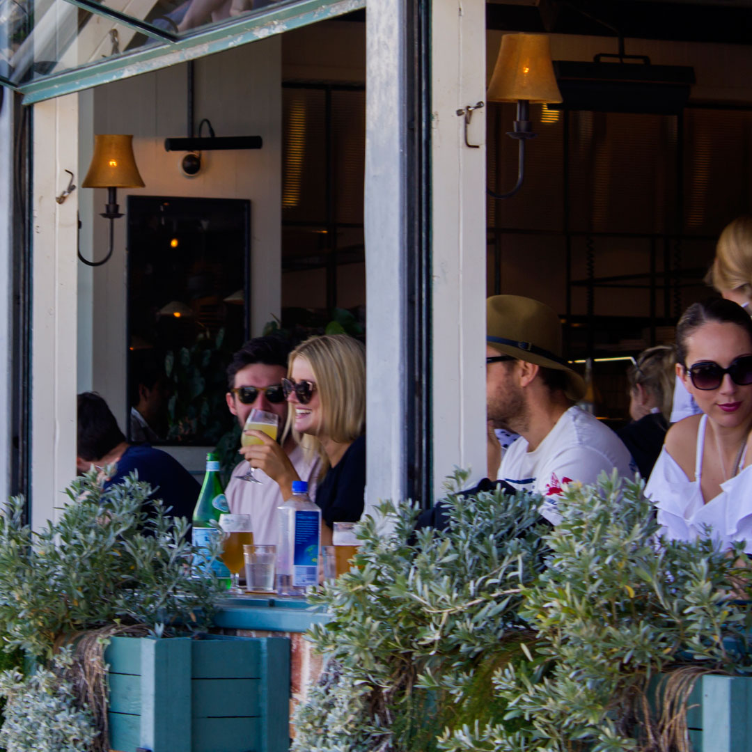 Customers enjoying chilled drinks prepared with clear ice in a commercial hospitality setting