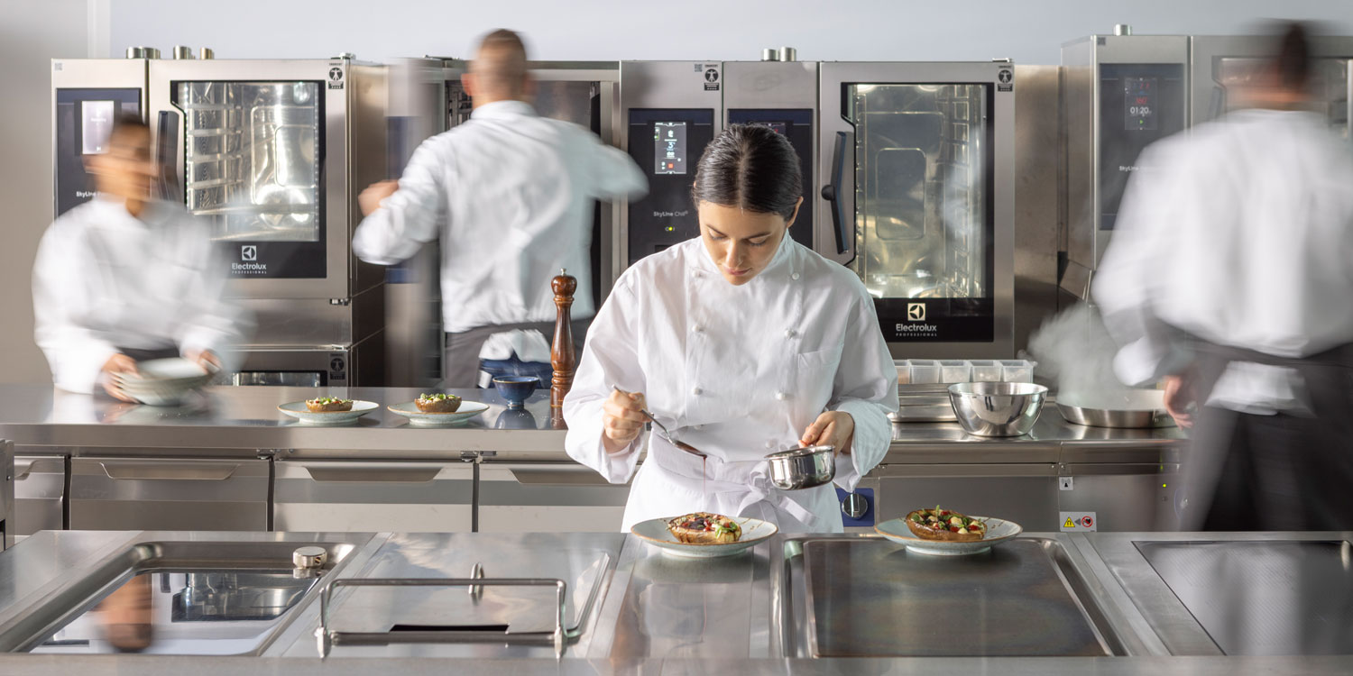 Chefs working in an Electrolux Professional commercial kitchen
